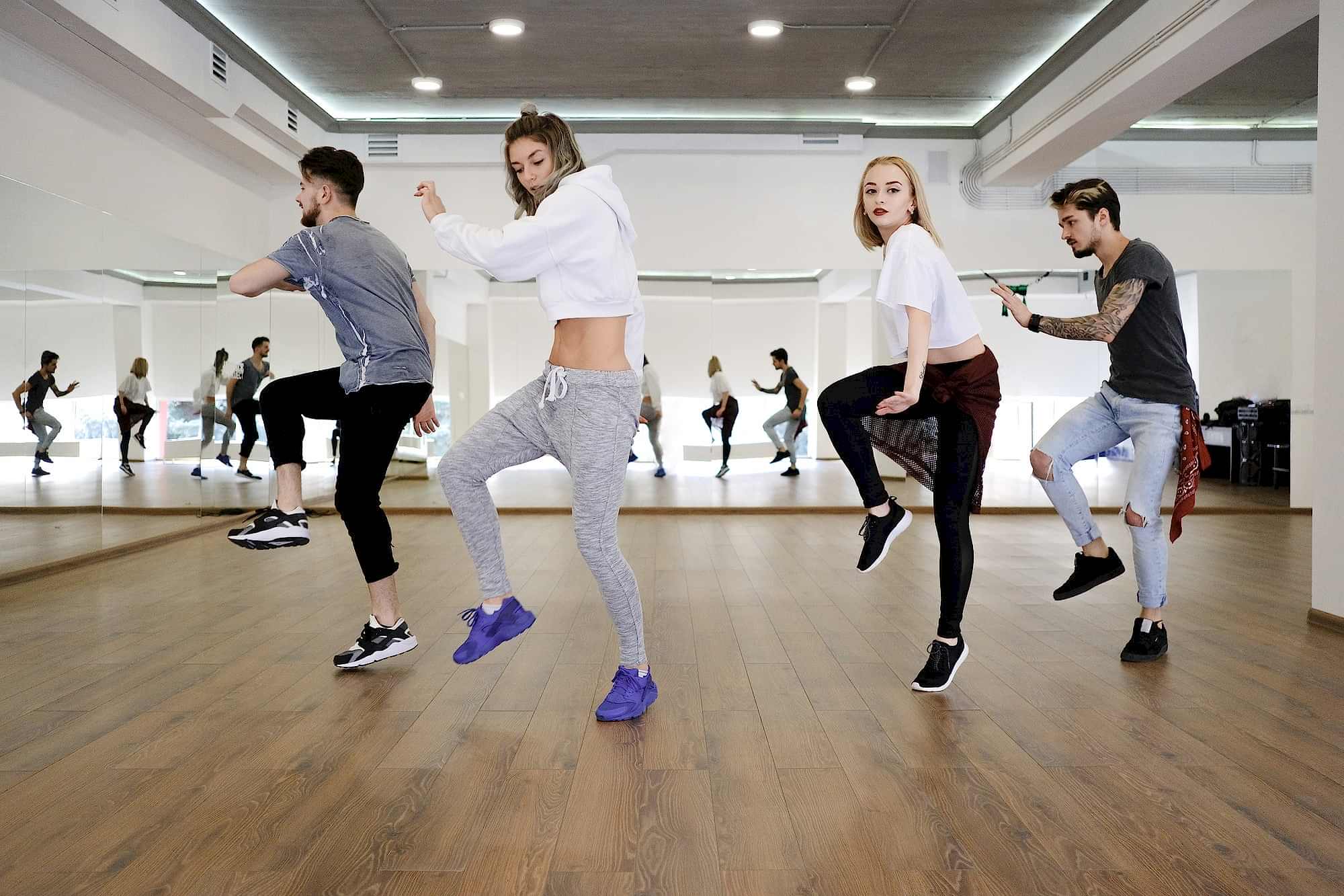 group of young modern dancers dancing in the studio 1